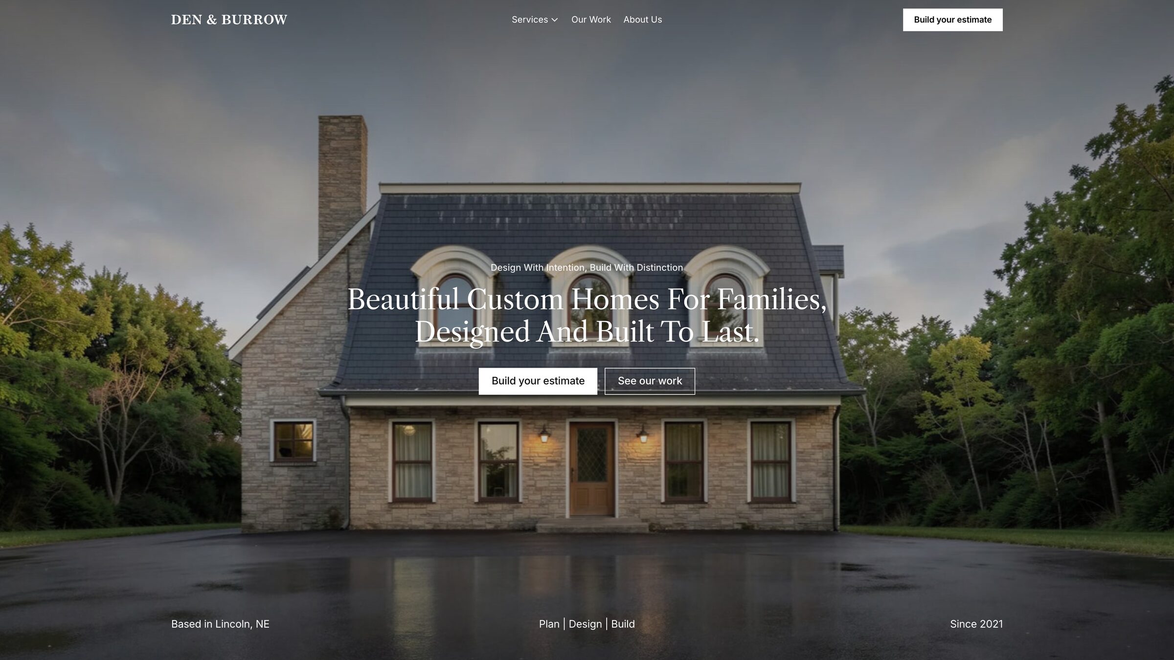 Den & Burrow homepage with a stone custom home at dusk